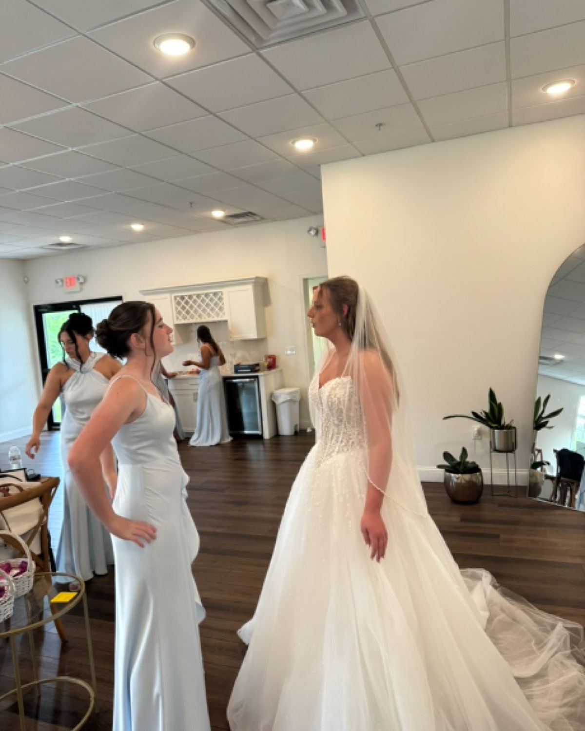 The bride getting ready with her bridesmaids